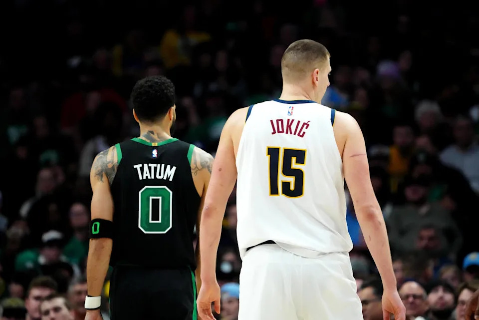 Denver Nuggets center Nikola Jokic (15) and Boston Celtics forward Jayson Tatum (0)© Ron Chenoy-Imagn Images