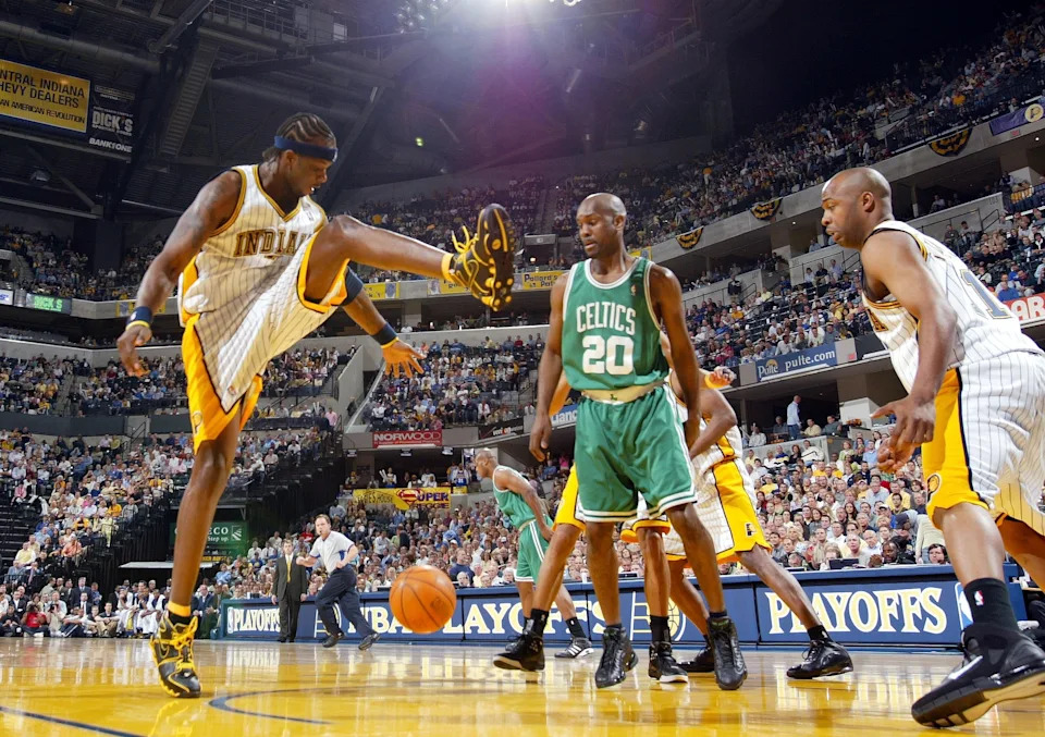 INDIANAPOLIS - MAY 5: Jermaine O'Neal #7 of the Indiana Pacers tries to get the rebound as Gary Payton #20 of the Boston Celtics looks on in Game six of the Eastern Conference Quarterfinals during the 2005 NBA Playoffs on May 5, 2005 at Conseco Fieldhouse in Indianapolis, Indiana. NOTE TO USER: User expressly acknowledges and agrees that, by downloading and or using this photograph, User is consenting to the terms and conditions of the Getty Images License Agreement. (Photo by Elsa/Getty Images)