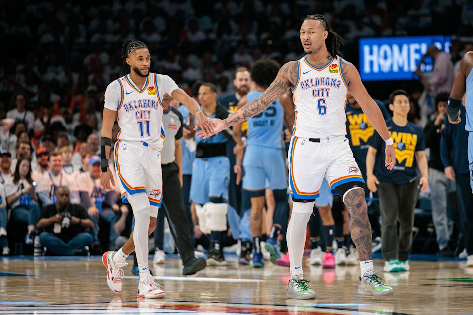 Oklahoma City's Jaylin Williams (6) slaps hands with Isaiah Joe (11) after a play in the third quarter against the Grizzlies during Game 1 of the first round of the playoffs at Paycom Center on April 20. Williams and Joe were also teammates at Northside High in Fort Smith, Arkansas.
