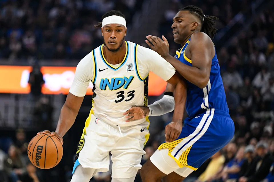 Dec 23, 2024; San Francisco, California, USA; Indiana Pacers center Myles Turner (33) dribbles against Golden State Warriors forward Kevon Looney (5) in the first quarter at Chase Center. Mandatory Credit: Eakin Howard-Imagn Images© Eakin Howard-Imagn Images