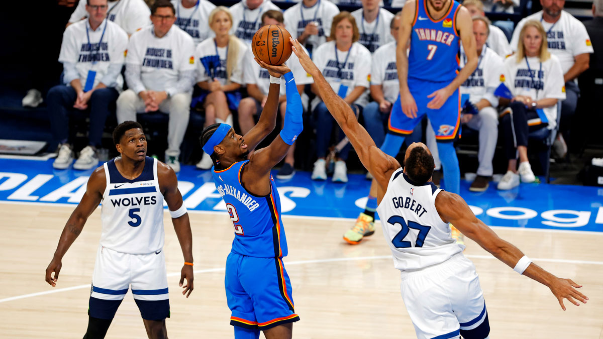 Oklahoma City Thunder guard Shai Gilgeous-Alexander (2) shoots the ball against Minnesota Timberwolves center Rudy Gobert (27) during the first quarter in game five of the western conference finals for the 2025 NBA Playoffs at Paycom Center. 