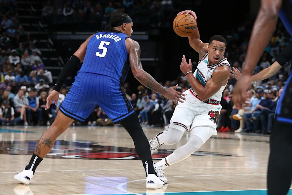 Memphis Grizzlies guard Desmond Bane drives to the basket as Orlando Magic forward Paolo Banchero defends.Petre Thomas-Imagn Images