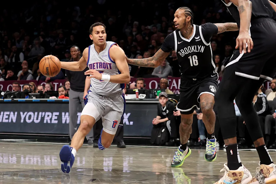 Mar 29, 2022; Brooklyn, New York, USA; Detroit Pistons guard Frank Jackson (5) drives to the basket against Brooklyn Nets forward James Johnson (16) during the second quarter at Barclays Center. Mandatory Credit: Brad Penner-USA TODAY Sports