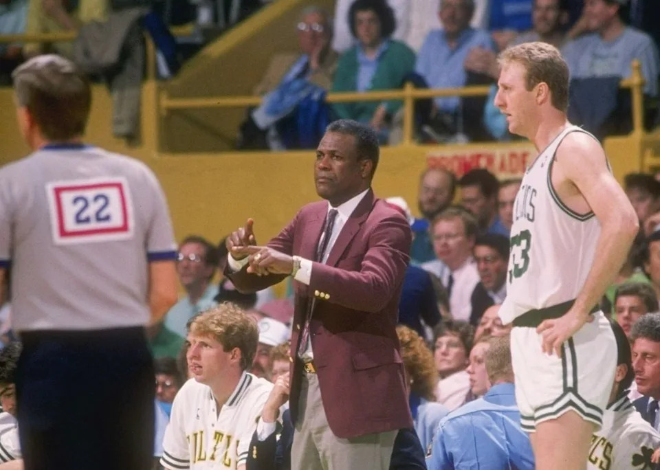 1988: Coach K.C. Jones and forward Larry Bird of the Boston Celtics talk to each other during a game at the Boston Garden in Boston, Massachusetts. Mandatory Credit: Allsport /Allsport