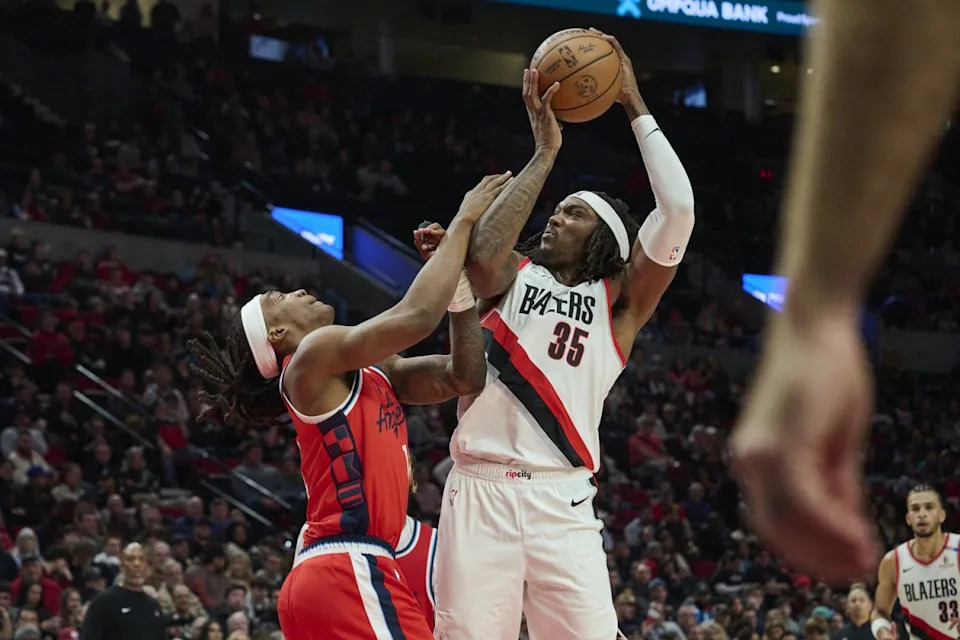 Portland Trail Blazers center Robert Williams III (35) grabs a rebound during the second half against LA Clippers guard Terance Mann (14) at Moda Center. Mandatory Credit: Troy Wayrynen-Imagn ImagesMandatory Credit: Troy Wayrynen-Imagn Images
