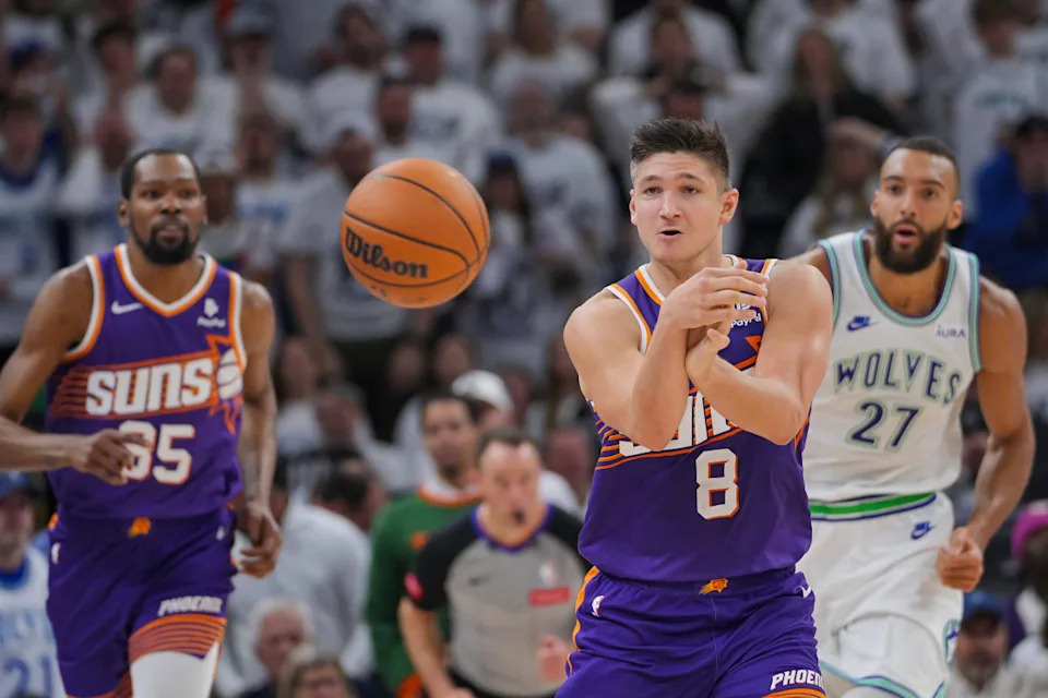 Apr 23, 2024; Minneapolis, Minnesota, USA; Phoenix Suns guard Grayson Allen (8) passes against the Minnesota Timberwolves in the second quarter during game two of the first round for the 2024 NBA playoffs at Target Center.Brad Rempel-USA TODAY Sports