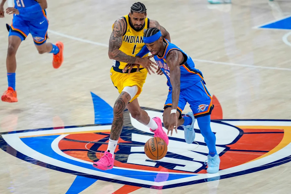 Thunder guard Shai Gilgeous-Alexander (2) drives past Pacers forward Obi Toppin (1) in the third quarter during Game 2 of the NBA Finals at Paycom Center on June 8.