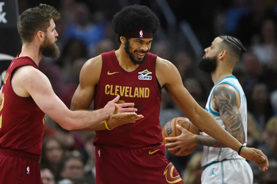 Cavaliers forward Dean Wade celebrates with center Jarrett Allen (middle) in the second quarter against the Hornets, Jan. 5, 2025, in Cleveland.