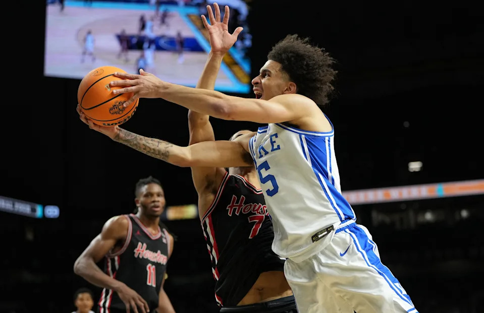Apr 5, 2025; San Antonio, TX, USA; Duke Blue Devils guard Tyrese Proctor (5) drives to the basket against Houston Cougars guard Milos Uzan (7) during the second half in the semifinals of the men's Final Four of the 2025 NCAA Tournament at the Alamodome. Mandatory Credit: Bob Donnan-Imagn Images ORG XMIT: IMAGN-1026925 ORIG FILE ID: 20250405_jcd_sd2_0310.JPG