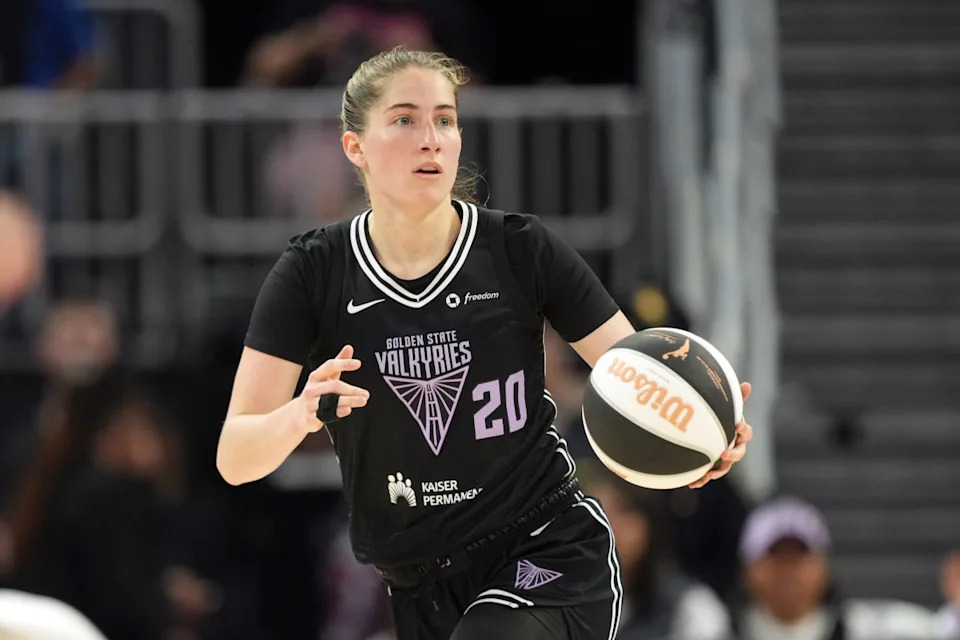 Golden State Valkyries guard Kate Martin (20) dribbles against the Las Vegas Aces.Darren Yamashita-Imagn Images