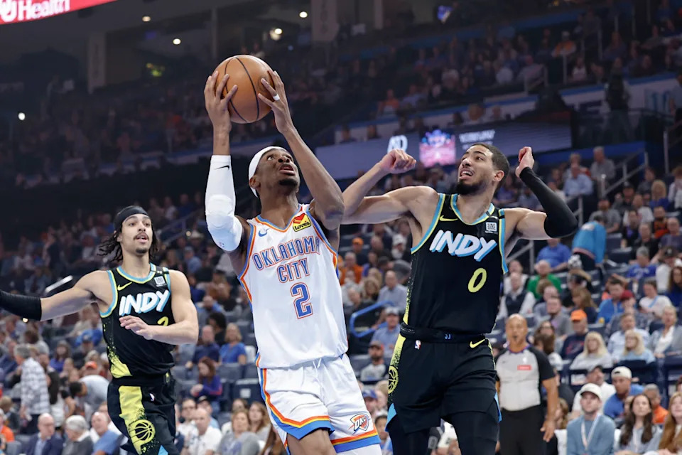 Mar 12, 2024; Oklahoma City, Oklahoma, USA; Oklahoma City Thunder guard Shai Gilgeous-Alexander (2) drives to the basket beside Indiana Pacers guard Tyrese Haliburton (0) during the first quarter at Paycom Center. © Alonzo Adams-Imagn Images
