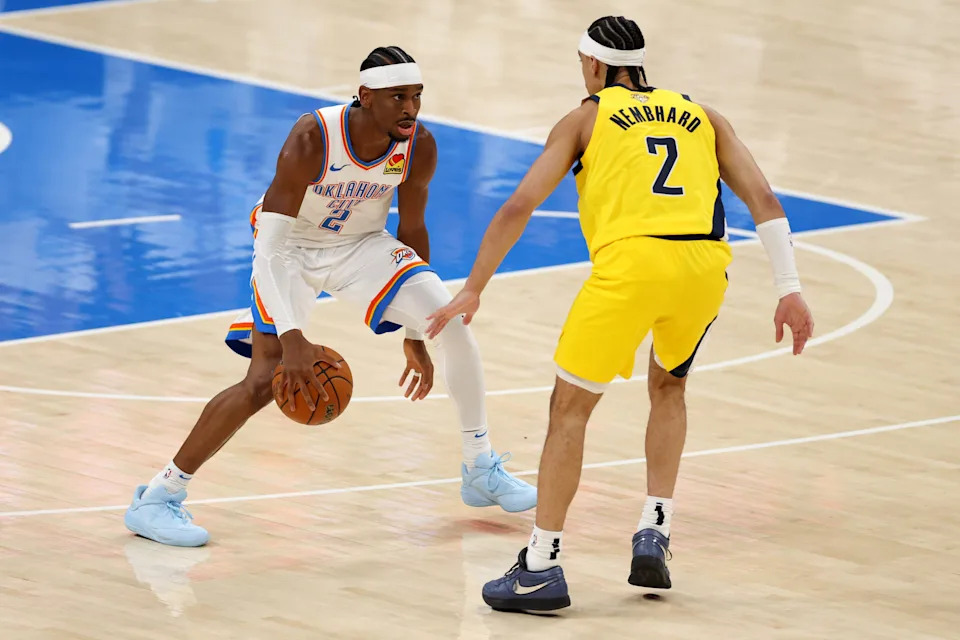 OKLAHOMA CITY, OKLAHOMA - JUNE 05: Shai Gilgeous-Alexander #2 of the Oklahoma City Thunder is defended by Andrew Nembhard #2 of the Indiana Pacers during the first quarter in Game One of the 2025 NBA Finals at Paycom Center on June 05, 2025 in Oklahoma City, Oklahoma. NOTE TO USER: User expressly acknowledges and agrees that, by downloading and or using this photograph, User is consenting to the terms and conditions of the Getty Images License Agreement. (Photo by Matthew Stockman/Getty Images)
