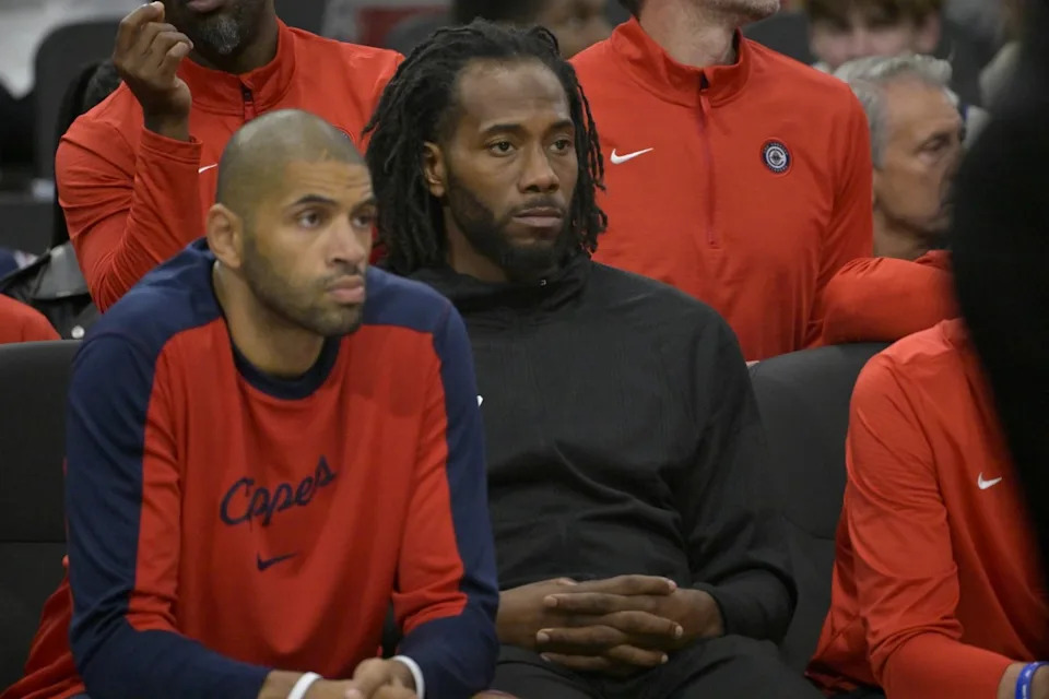 USA: Los Angeles Clippers forward Kawhi Leonard (2) looks on from the bench as he sits next to forward Nicolas Batum (33) in the first half against the Portland Trail Blazers at Intuit Dome.© Jayne Kamin-Oncea-Imagn Images