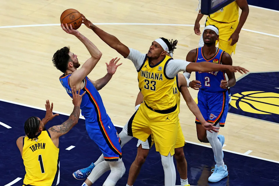 Pacers center Myles Turner (33) blocks the shot of Thunder forward Chet Holmgren (7).Trevor Ruszkowski-Imagn Images