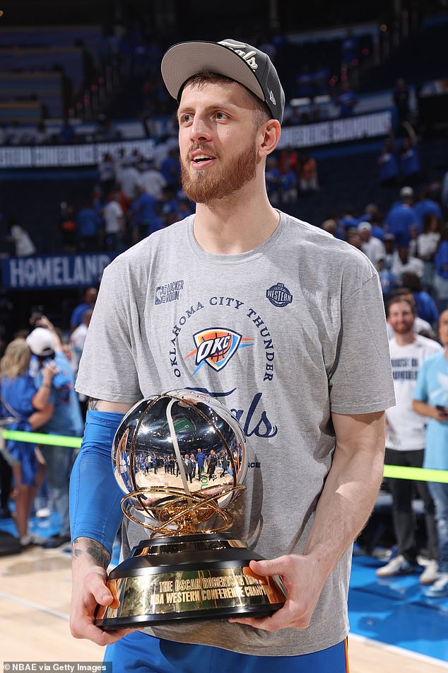 Isaiah Hartenstein is seen with the Western Conference Championship trophy after the Thunder beat the Timberwolves