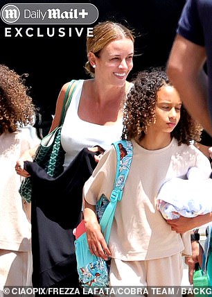 The former model kept it casual, adding a hint of glamor with a Goyard tote and eye-catching diamond earrings