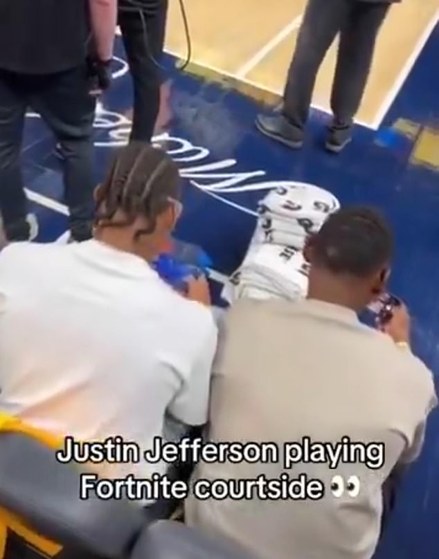 A clip from the Indiana Pacers’ Game 6 win over the Oklahoma City Thunder shows Jefferson (left) playing ‘ Fortnite ’ on his mobile device as a seatmate thumbs around on his phone