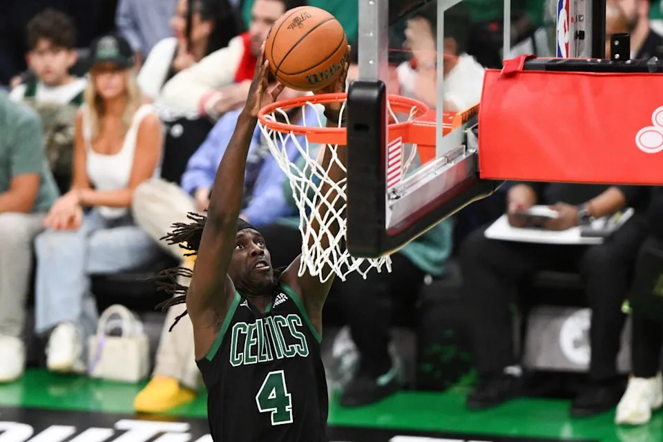 Jun 9, 2024; Boston, Massachusetts, USA; Boston Celtics guard Jrue Holiday (4) dunks and scores against the Dallas Mavericks during the second half of game two of the 2024 NBA Finals at the TD Garden. USA TODAY Sports Images