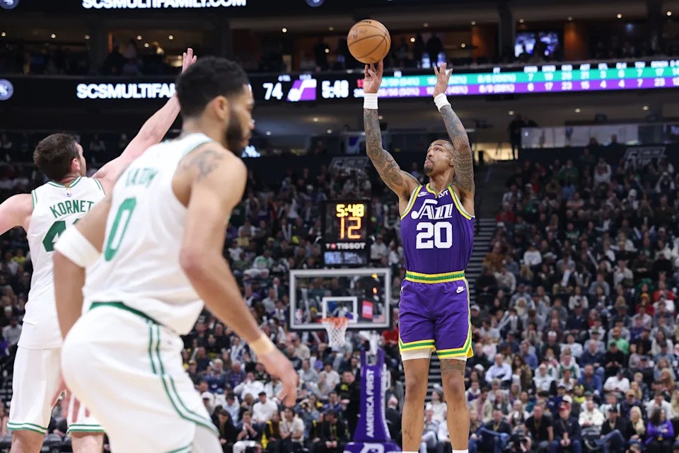 Mar 12, 2024; Salt Lake City, Utah, USA; Utah Jazz forward John Collins (20) takes a three-point shot against the Boston Celtics during the third quarter at Delta Center. Mandatory Credit: Rob Gray-USA TODAY Sports