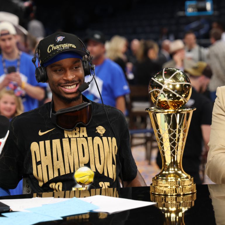 OKLAHOMA CITY, OK - JUNE 22: Shai Gilgeous-Alexander #2 of the Oklahoma City Thunder sales after winning the 2025 NBA Finals against the Indiana Pacers during Game 7 of the 2025 NBA Finals on June 22, 2025 at Paycom Center in Oklahoma City, Oklahoma. NOTE TO USER: User expressly acknowledges and agrees that, by downloading and or using this photograph, User is consenting to the terms and conditions of the Getty Images License Agreement. Mandatory Copyright Notice: Copyright 2025 NBAE Joe Murphy/NBAE via Getty Images/AFP (Photo by JOE MURPHY / NBAE / Getty Images / Getty Images via AFP)