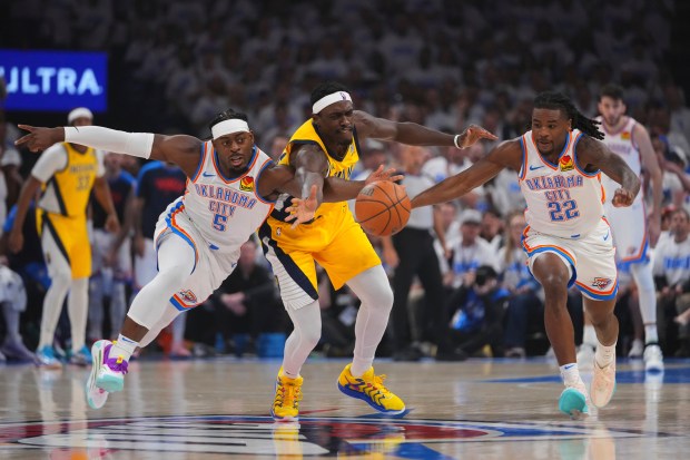Oklahoma City Thunder guard Luguentz Dort (5), guard Cason Wallace...