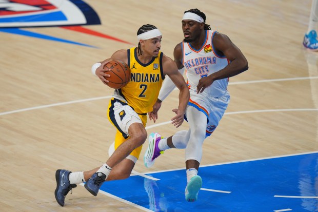 Indiana Pacers guard Andrew Nembhard (2) controls the ball against...