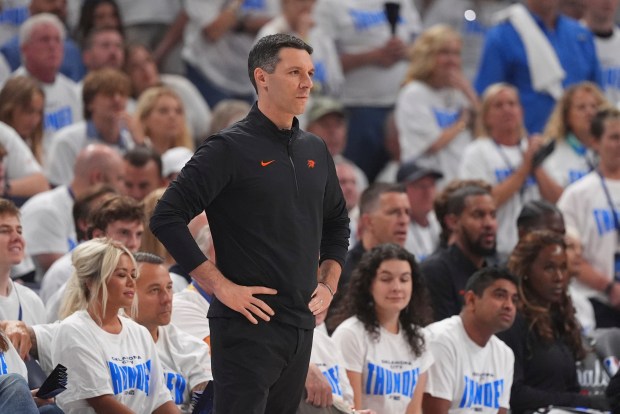 Oklahoma City Thunder head coach Mark Daigneault stands on the...