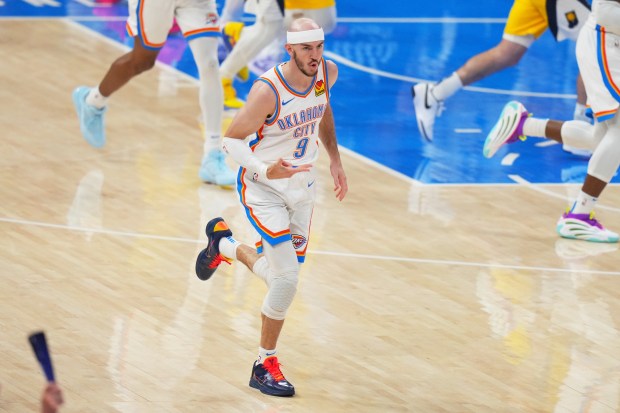Oklahoma City Thunder guard Alex Caruso (9) celebrates after making...