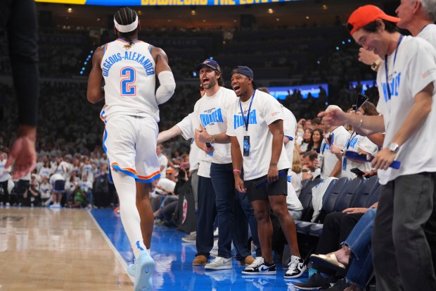 Fans cheer for Oklahoma City Thunder guard Shai Gilgeous-Alexander (2)...