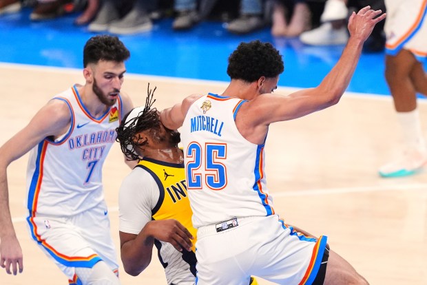 Oklahoma City Thunder guard Ajay Mitchell (25) collides with Indiana...
