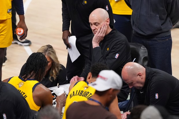 Indiana Pacers head coach Rick Carlisle walks with players during...