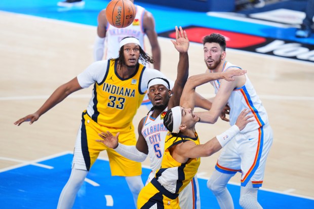 Oklahoma City Thunder guard Luguentz Dort (5) fouls Indiana Pacers...