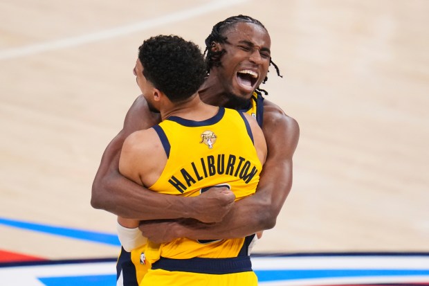 Indiana Pacers guard Tyrese Haliburton, left, celebrates with forward Aaron...