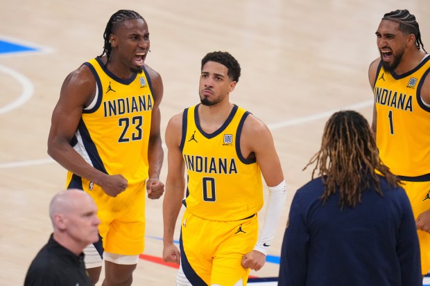 Indiana Pacers guard Tyrese Haliburton (0) celebrates with forward Aaron...