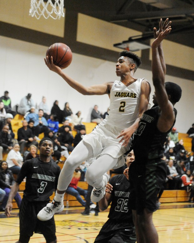 Bethel's Chance McMillian elevates to the hoop for two of his 32 points in the Jaguars' 78-71 win over Rodriguez in 2019 .(Chris Riley--Times-Herald File)