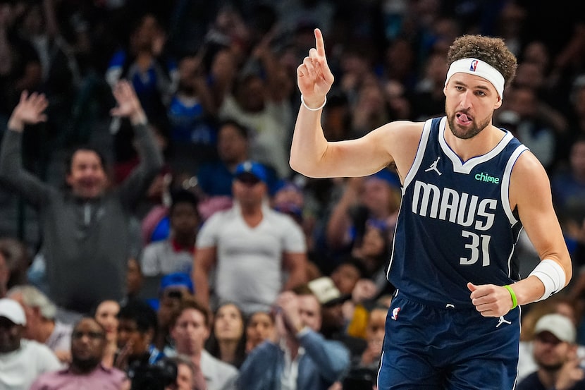Dallas Mavericks guard Klay Thompson celebrates a basket during the second half of an NBA...