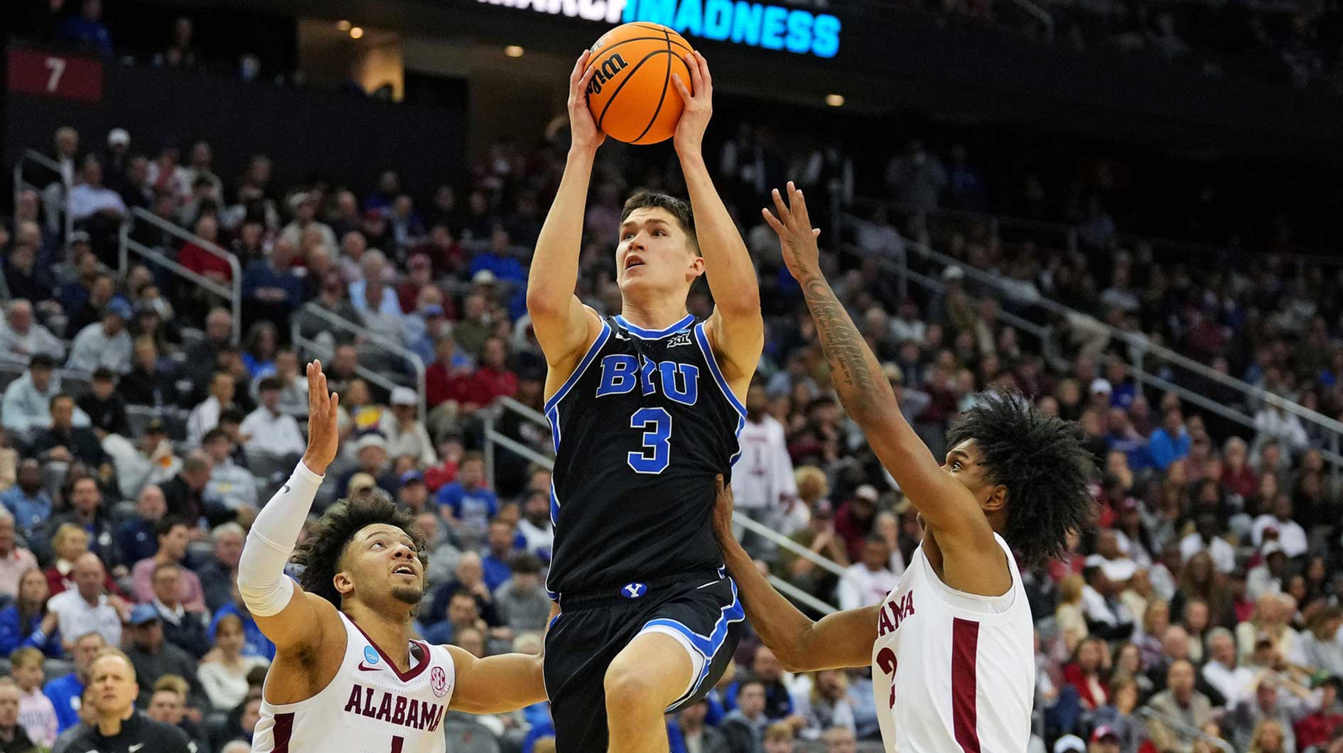 Brigham Young Cougars guard Egor Demin (3) drives to the basket against Alabama Crimson Tide guard Mark Sears (1) during the second half during an East Regional semifinal of the 2025 NCAA tournament at Prudential Center.