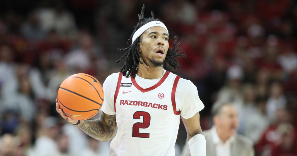 Jan 11, 2025; Fayetteville, Arkansas, USA; Arkansas Razorbacks guard Boogie Fland (2) dribbles during the first half against the Florida Gators at Bud Walton Arena. Mandatory Credit: Nelson Chenault-Imagn Images
