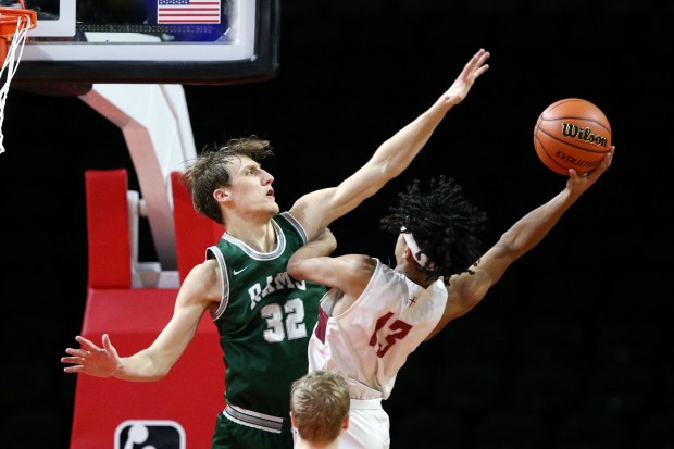 Grayslake Central's Jake Gibson tries to block a shot by St. Ignatius' Phoenix Gill during the Class 3A Hoffman Estates Supersectional on March 6, 2023. (Mark Ukena/For the Lake County News-Sun)