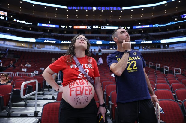 Fever and Caitlin Clark fans Brittani McAdams and Andrew McAdams take in the scene at the United Center before a Sky-Fever game on June 7, 2025. Brittani is expecting a baby in mid-July. (Chris Sweda/Chicago Tribune)