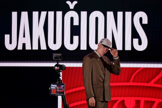 Kasparas Jakučionis poses for a camera after being selected 20th by the Miami Heat in the first round of the NBA draft on June 25, 2025, in New York. (AP Photo/Adam Hunger)