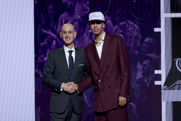 Will Riley shakes hands with NBA Commissioner Adam Silver after the Utah Jazz drafted him at No. 21 on Wednesday, June 25, 2025. (Sarah Stier/Getty Images)