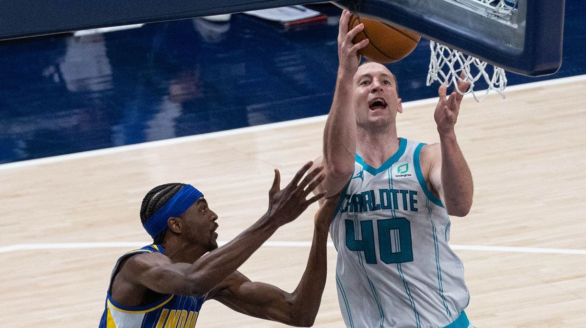 Charlotte Hornets center Cody Zeller (40) shoots the ball and is fouled by Indiana Pacers forward Justin Holiday (8) in the third quarter at Bankers Life Fieldhouse.
