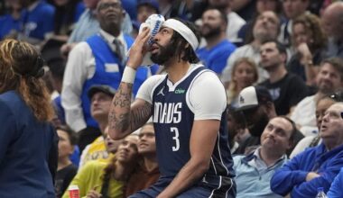 Dallas Mavericks forward Anthony Davis sits after getting inured during the first half of an NBA basketball game against the Atlanta Hawks in Dallas, Wednesday, April 2, 2025. (AP Photo/LM Otero)