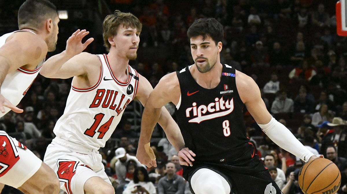Portland Trail Blazers forward Deni Avdija (8) moves the ball against Chicago Bulls forward Matas Buzelis (14) during the first half at United Center.