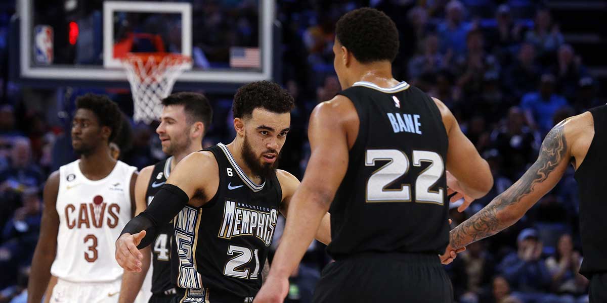 Memphis Grizzlies guard Tyus Jones (21) celebrates with guard Desmond Bane (22) during the first half against the Cleveland Cavaliers at FedExForum.