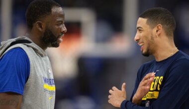 Golden State Warriors forward Draymond Green (23) and Indiana Pacers guard Tyrese Haliburton (0) chat before a game at Chase Center.