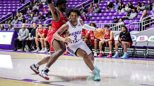 Weber State forward Dillon Jones, right, drives toward the basketball against Benedictine Mesa during a Nov. 2023 nonconference men's basketball game in Ogden, Utah. Jones has been one of the best players in the Big Sky Conference during the 2023-24 seasons. Jones and Weber State meet Northern Colorado at 6 p.m. Saturday, Feb. 3 at Bank of Colorado Arena in Greeley. (Courtesy/Robert Casey-Weber State Athletics).