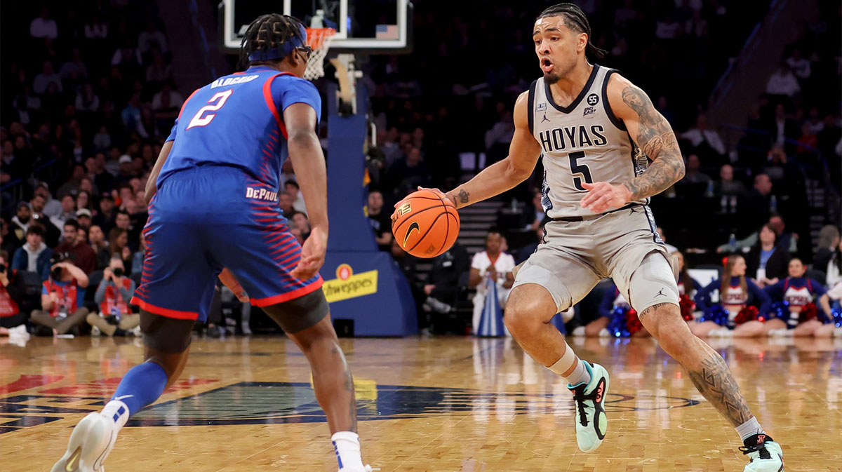 Georgetown Hoyas guard Micah Peavy (5) controls the ball against DePaul Blue Demons guard Layden Blocker (2) during the second half at Madison Square Garden.