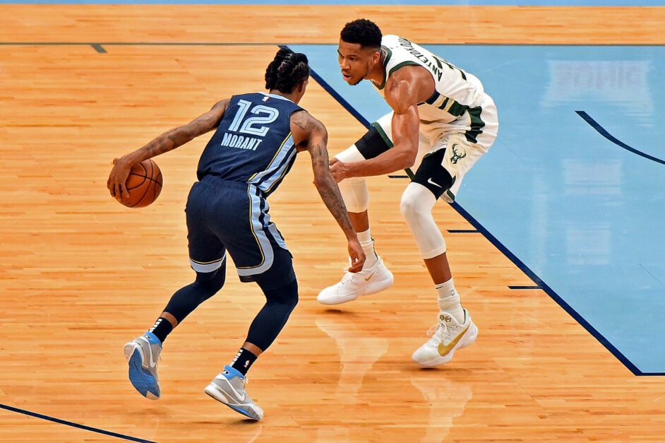 Milwaukee Bucks forward Giannis Antetokounmpo defends Memphis Grizzlies guard Ja Morant